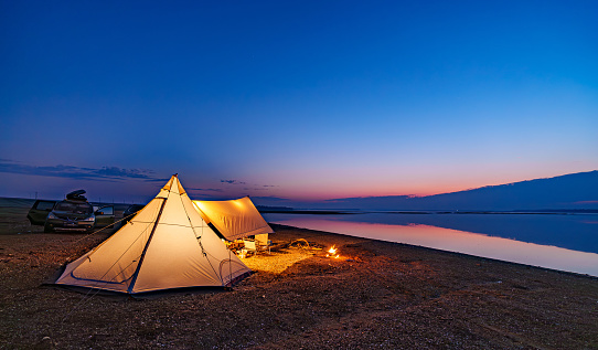 Camping tent in a camping in a forest by the Oka river. Russia