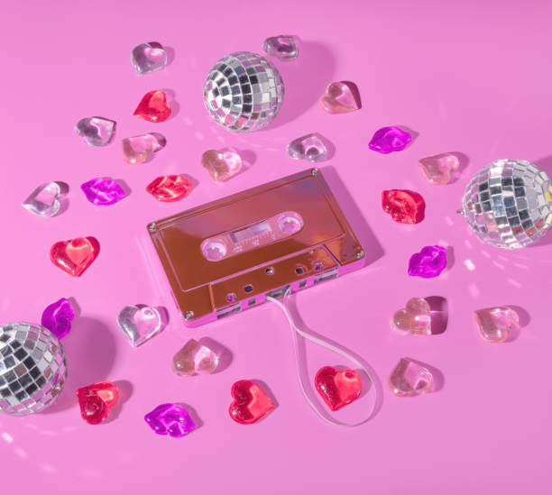 Love Song Play list Concept, Retro Music Cassette Tape Concept Surrounded by Lips and Red Hearts and Disco Balls, Mix Tape, Valentine's Mixed Tape Love Songs Playlist Concept, Retro Music Cassette Tape Concept Surrounded by Lips and Red Hearts and Disco Balls, Mix Tape, Valentine's Mixed Tape mix tape heart stock pictures, royalty-free photos & images