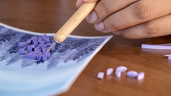 Creative Process of Quilling: Making a Purple-Painted Greeting Card with Paper Strips