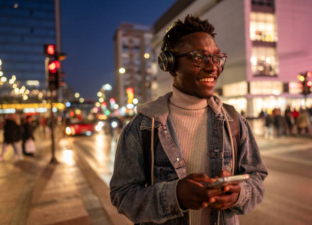 istock Handsome black man using phone in the city 1898947322