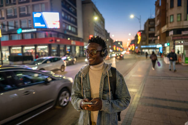 istock Handsome black man using phone in the city 1898948863