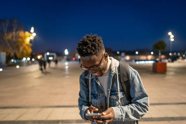 istock Using smart phone at the street 1898951435