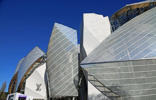 Modern glass panels exterior of Louis Vuitton Foundation, art museum and cultural center in Paris, France. Picture made on 27 Feb 2023