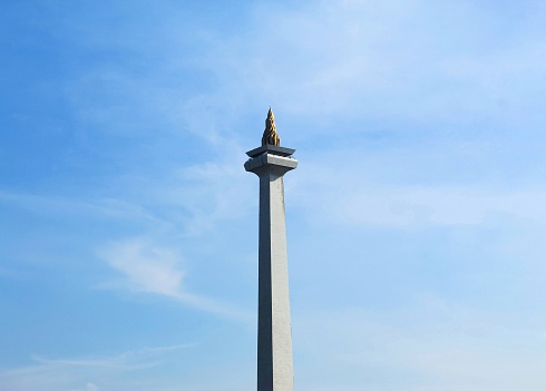 Indonesian national monument with blue sky background