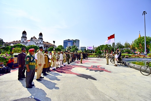 “Semarang, Indonesia – August 17, 2022 : The antique bicycle community held a Flag Ceremony during the commemoration of the independence day of the Republic of Indonesia in the Tugu Muda monument area, Semarang, Indonesia\