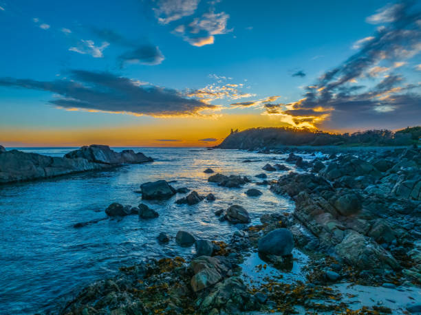 istock Coastal Sunrise with Rock Formations 1899105935