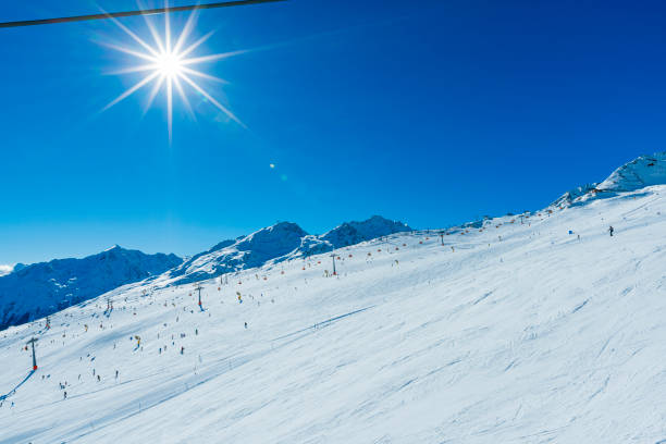 Slovakia. Winter sunny day at the ski resort Jasna. Several skiers on a gentle ski slope