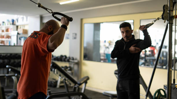 istock Professional trainer giving a lesson in the gym 1899127763