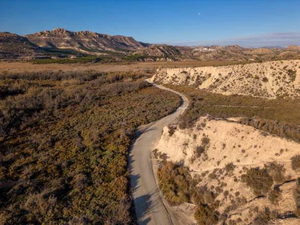 istock Beautiful scenery with winding dirt road 1899156907