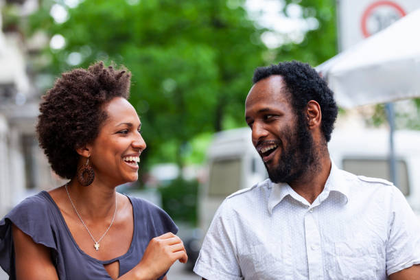 istock Happy black couple walking on street 1899157428