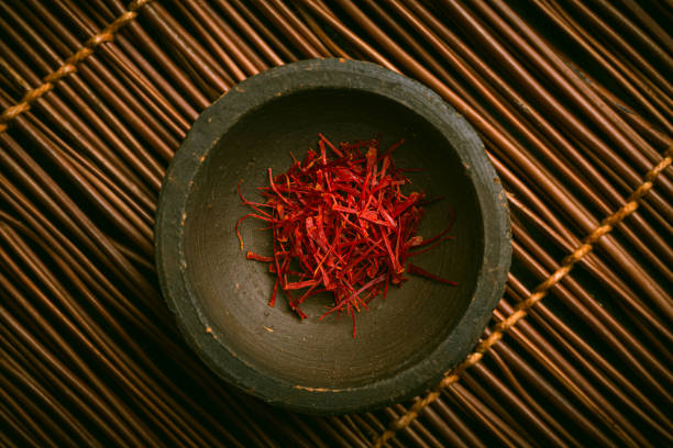 Saffron threads in a small bowl. Spices, cooking ingredients, flavor.