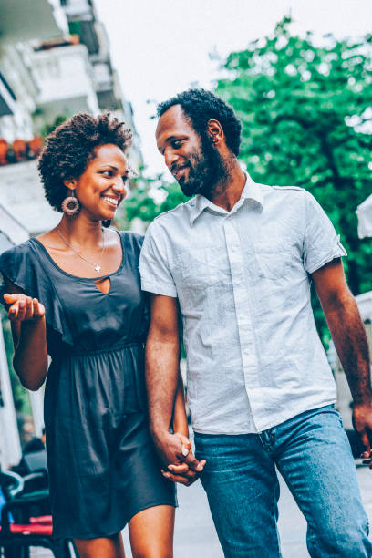 istock Happy black couple walking on street 1899157961