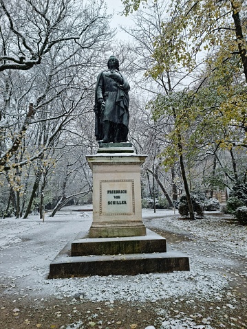 A Schiller Monument at t he Maximilian Square in Munich City. The monument was presented to public in may 1863. The  image was captured durin winter season.