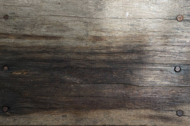 istock Old brown wood background with rusty nail 1899187053