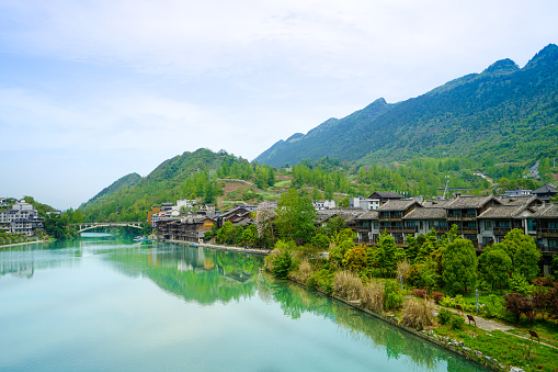 On one side of the lake is an old town and on the other side is a modern town. Zhoushui Ancient Town is a historical and cultural attraction. Chongqing, China.