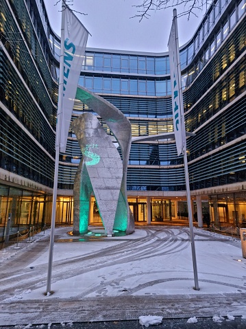 The headquartes of Siemens is located in Munich, Germany. The building was relized after plans by Henning Larsen Architects and opened in 2016. The image shows the main entrance captured during winter season.