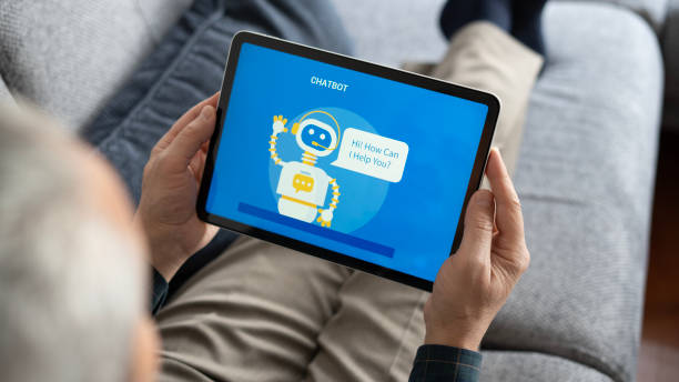 istock Adult man using chatbot with tablet at home 1899220180