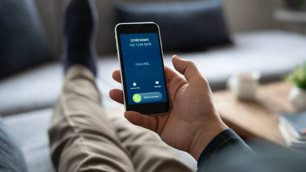 Close-up Unknown number call to senior man at home