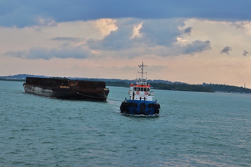 A tugboat operating at sea. Batam, 30 December 2023