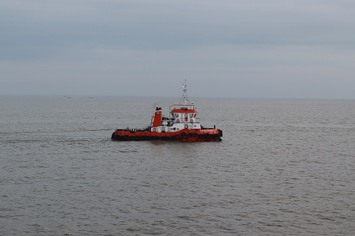 Tugboat is towing a barge. Jambi, 7 August 2023