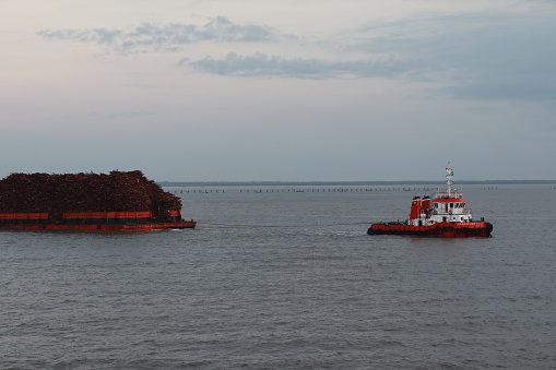 Tugboat is towing a barge. Jambi, 7 August 2023