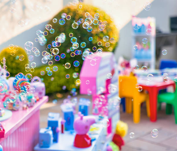 kids birthday party, soap bubbles flying in the yard