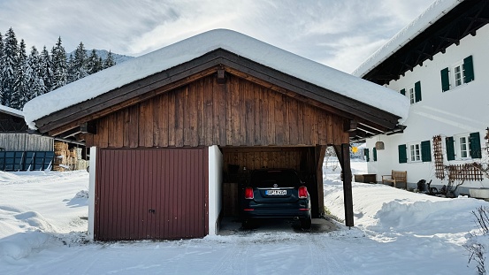 Elmau, Germany - December, 9th - 2023: Lots of snow on a parking garage.