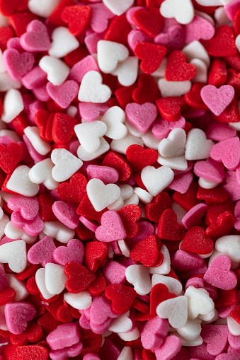 background of confectionery sprinkles in the form of hearts
