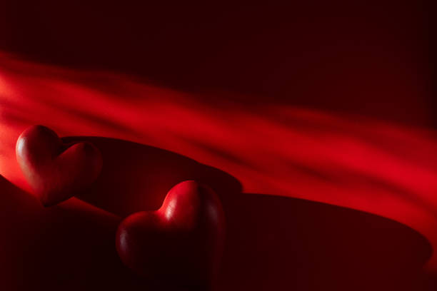 two red hearts upside down isolated on white