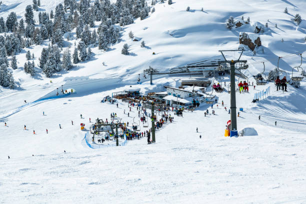 istock Skiers skiing at winter ski resort 1899441034