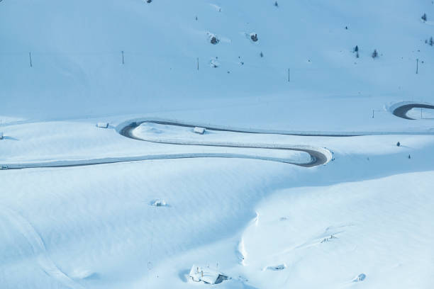istock Curvy road in high snow 1899447747