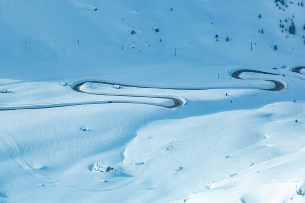 istock Curvy road in high snow 1899447892