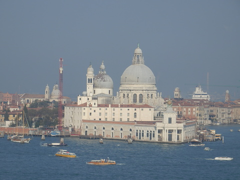 view of venice its cathedrals colors and positive atmosphere.  Blue sky and leaden sea, their roofs