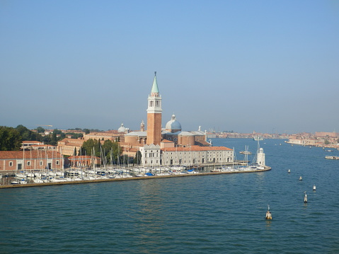 View of moored gondolas and San Giorgio Maggiore in Venice at sunrise