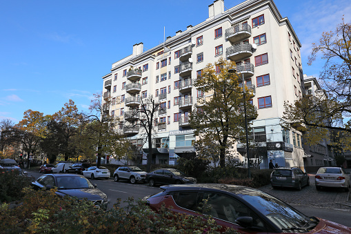Warsaw, Poland - November 1, 2023: Block of flats with balconies on the street in the Saska Kepa housing estate, Praga-Poludnie district.