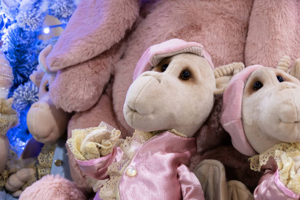 istock Soft toy Dragon near the New Year tree. 1899509779