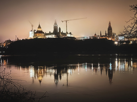 Parliament Hill in Ottawa, Ontario Canada on a foggy evening.