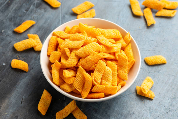 istock Crunchy Nacho cheese corn snack in white bowl 1899560918