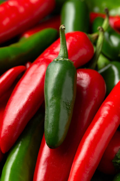 istock Fresh red and green peppers background. 1899563009