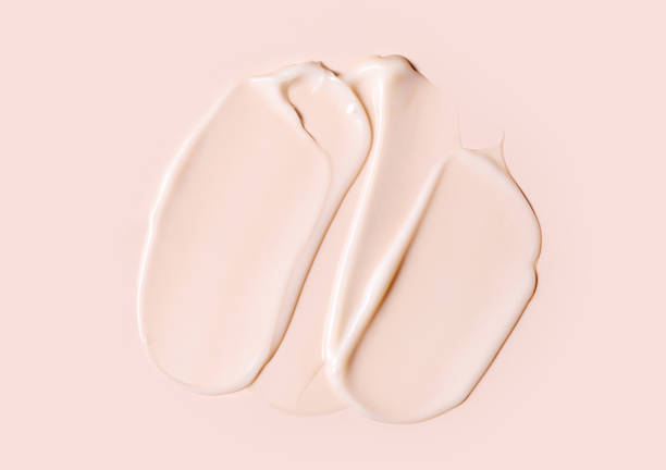 istock cosmetic smear texture on pastel beige background 1899609432
