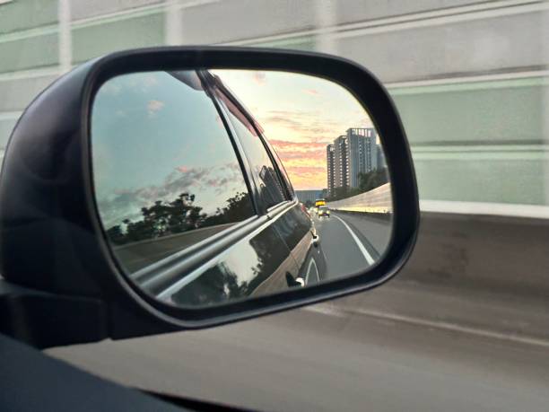 istock twilight behind the car rearview mirror 1899618401