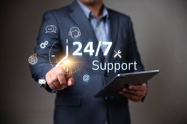 istock customer services and consulting concept, Businessman holding icon virtual 24/7 support services, Full-time available service. 1899664760