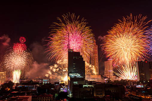 Bangkok, Thailand - December 31, 2021 : Amazing Thailand Countdown 2022 celebration with multicolor Japanese firework display on Chaophraya River at Icon Siam, Bangkok city, Thailand