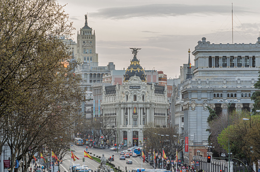 Madrid, Spain - March 21, 2014: Urban landscape in Madrid, Spain with the Metropolis Building at the intersection of Alcala and Gran Via streets