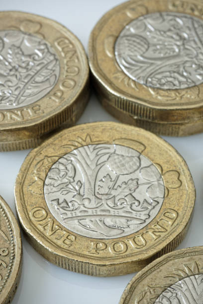 istock Used £1 (One Pound Sterling) UK Coins in Close Up. 1899708234