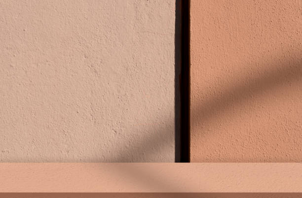 istock Beige Studio Background,Orange Wall Stone Concrete Rough Texture with Light,Shadow, Exterior solid Cement plastered stucco wall grain surfaces,Empty brushed print sand brick floor 1899723150