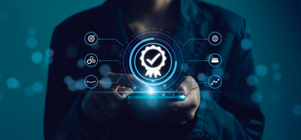 istock Businessman used smartphone show Certification Quality Assurance Guarantee. ISO certificate and standardization Business process control industrial technology and workflow. 1899787707