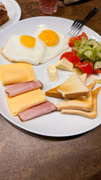 istock Hearty Morning Delight: Scrambled Eggs, Cheese, Ham, and Veggies 1899812588