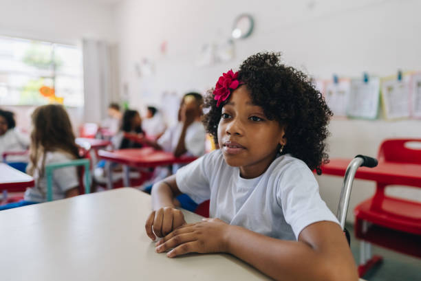 istock Girl student studying on classroom at school 1899817426