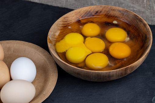 raw chicken egg used in cooking, fresh chicken eggs on the kitchen table